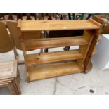 AN OPEN PINE FOUR TIER BOOKCASE AND SMALL CORNER STORAGE RACK