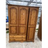 A MODERN PINE 3 DOOR WARDROBE WITH 2 DRAWERS TO BASE 55" WIDE