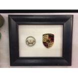 TWO FRAMED CAR BADGES TO INCLUDE FERRARI AND PORSCHE