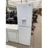 A WHITE BEKO UPRIGHT FRIDGE FREEZER WITH WATER DISPENSER BELIEVED IN WORKING ORDER BUT NO WARRANTY