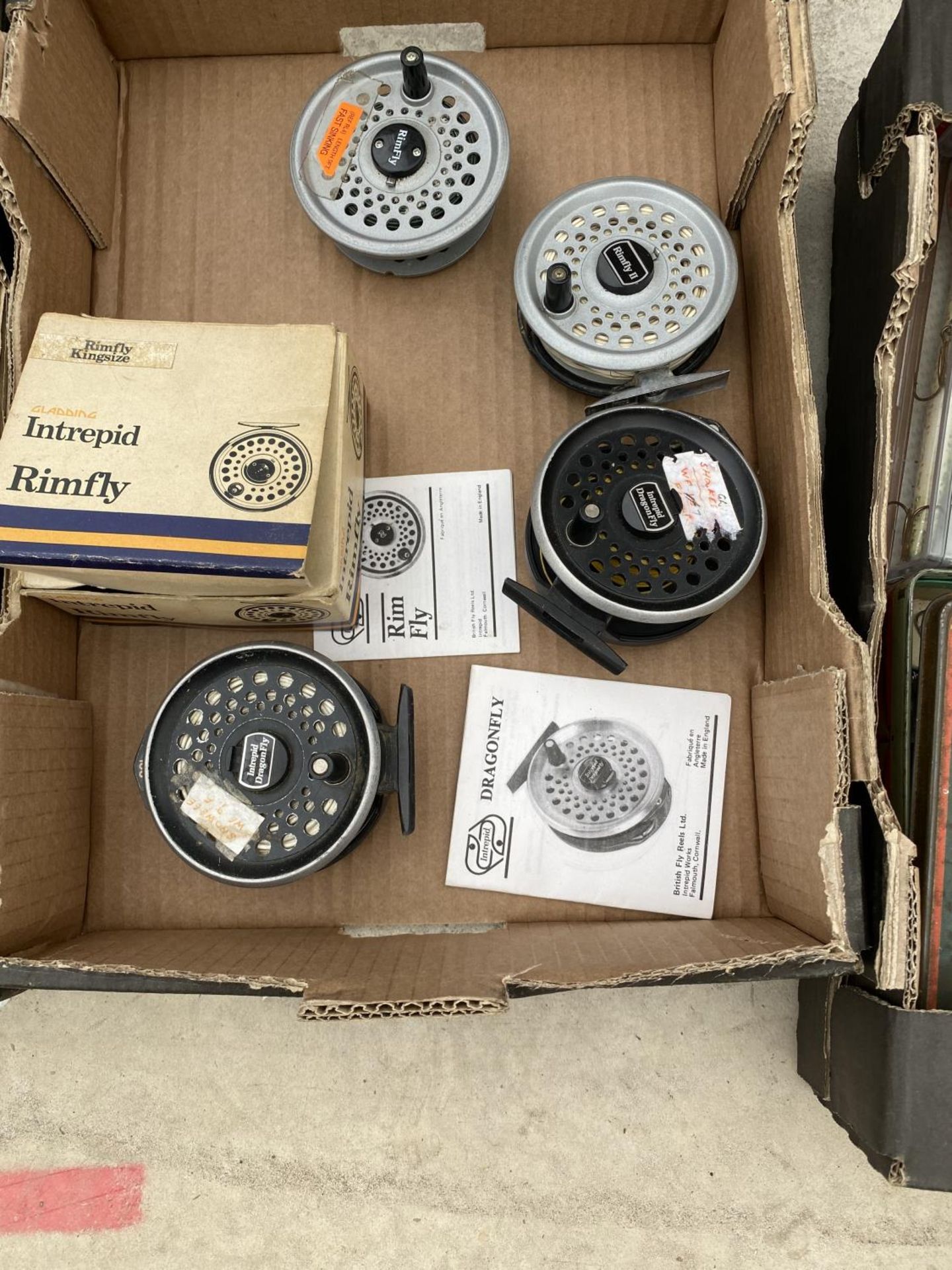 TWO DRAGONFLY FLY FISHING REELS, A REGULAR RIMFLY REEL AND A KINGSIZE RIMFLY REEL AND SPARE SPOOL