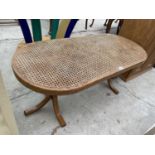 A MODERN COFFEE TABLE WITH SPLIT CANE TOP, ON BENTWOOD LEGS