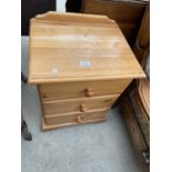 A PINE BEDSIDE CHEST OF THREE DRAWERS