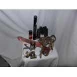 A MIXED LOT TO INCLUDE LEATHER DOG MUZZLE, TORCH, GUN CLEANING KIT, BINOCULARS, SPURS ETC