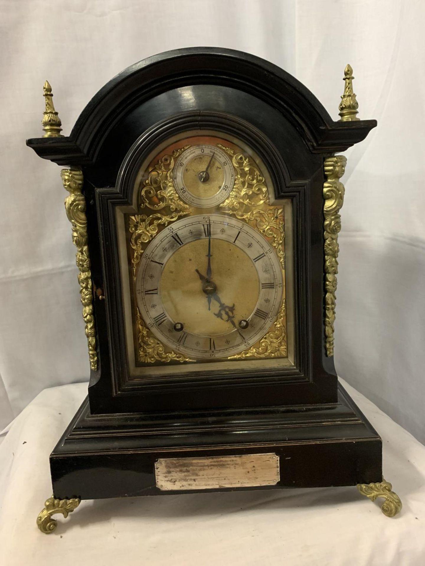 A VICTORIAN EBONISED BRACKET CLOCK WITH SILVERISED DIAL, GILDED DECORATION AND PIERCED SIDE
