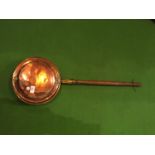 A BRASS WITH WOODEN HANDLED BED WARMING PAN