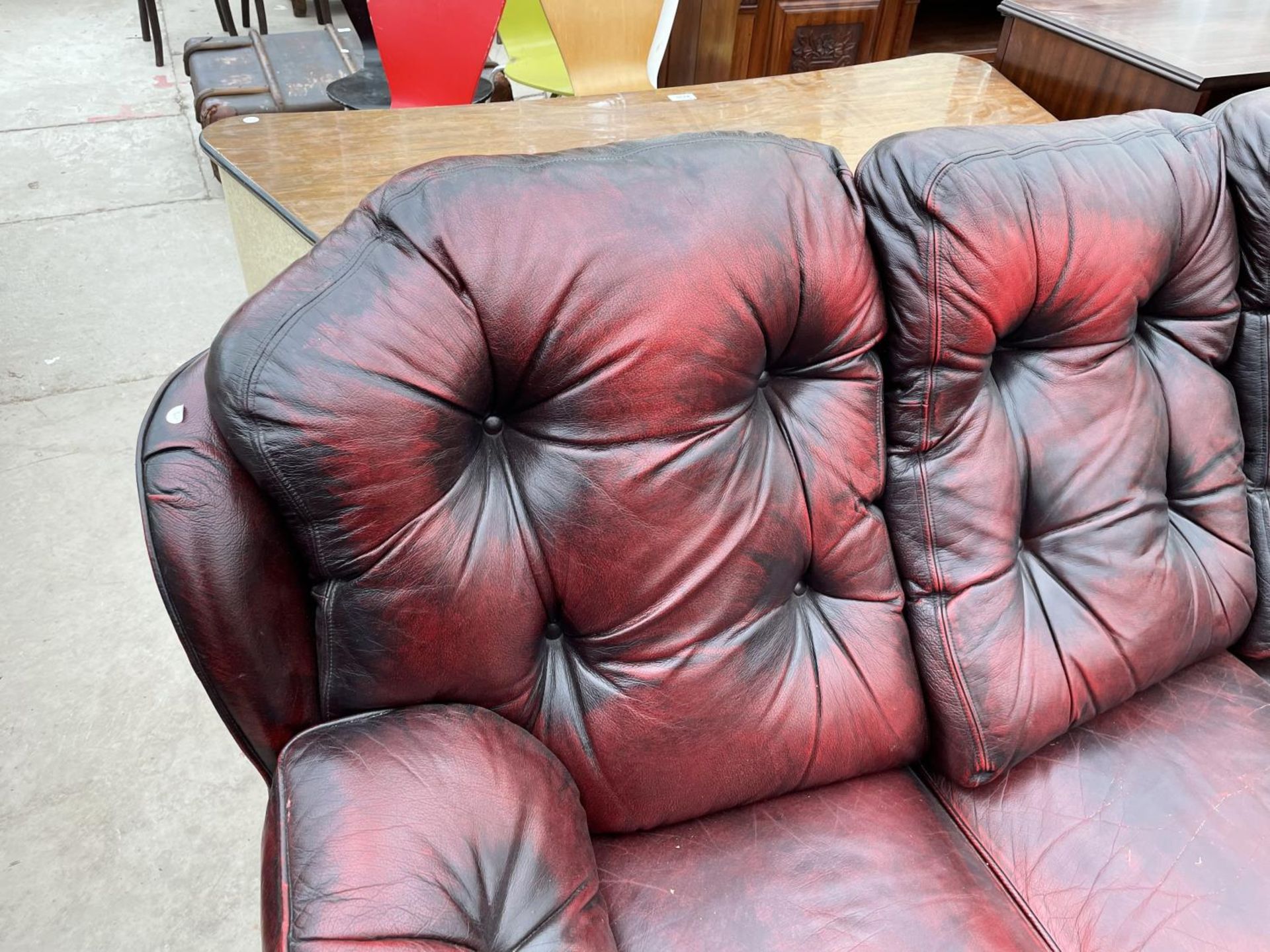 AN OXBLOOD BUTTON-BACK THREE SEATER SETTEE - Image 2 of 5