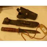 A BOWIE KNIFE, 17.5CM BLADE, LEATHER SCABBARD AND SHARPENING STONE AND A LEATHER HOLSTER