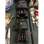 TWO PAIRS OF BINOCULARS. ONE BEING A PAIR OF BOOTS ADMIRAL II 10 X 50MM FULLY COATED BINOCULARS.