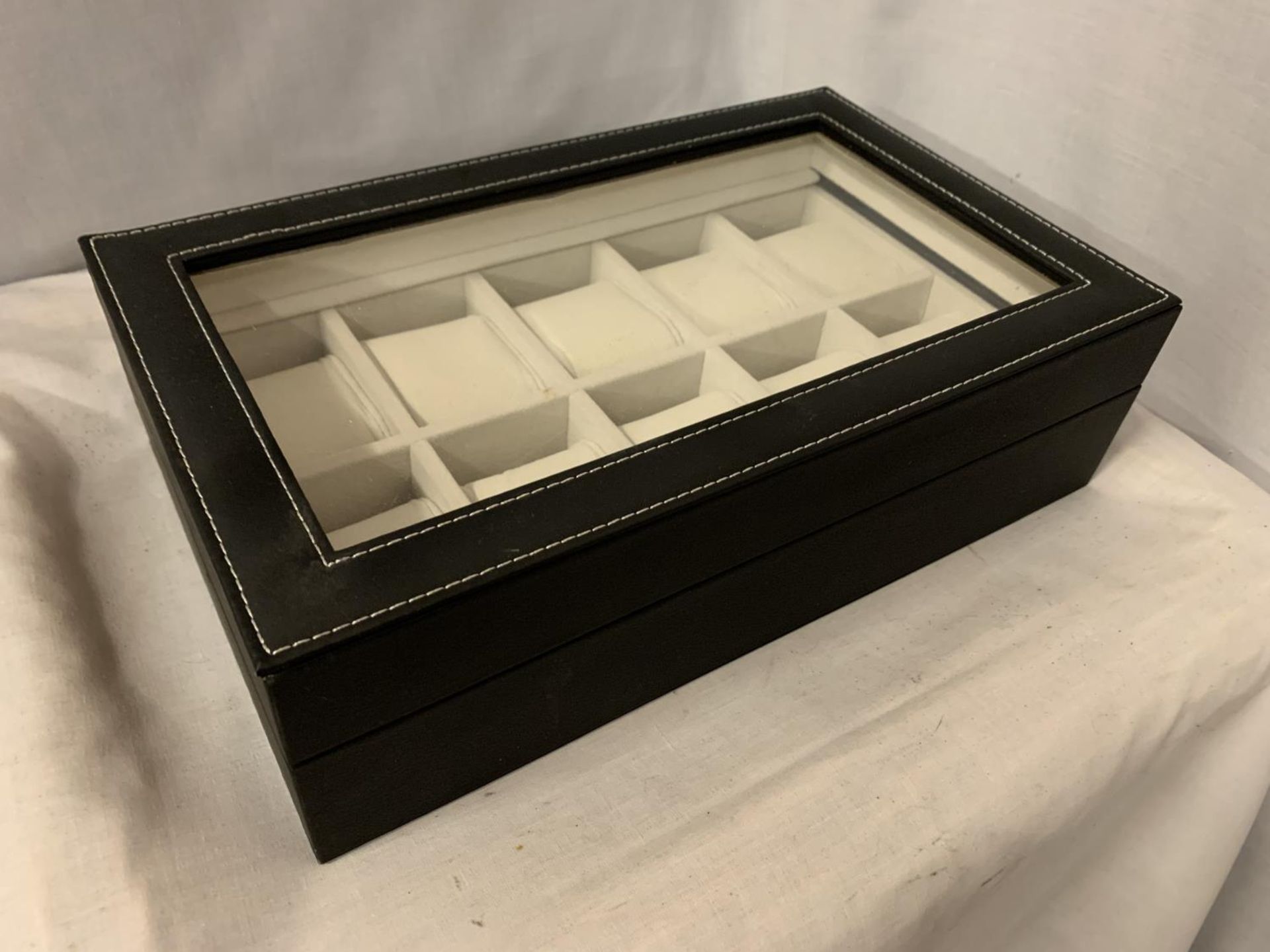 A FAUX LEATHER WATCH DISPLAY PLASTIC LIDDED CASE TO DISPLAY TEN WATCHES