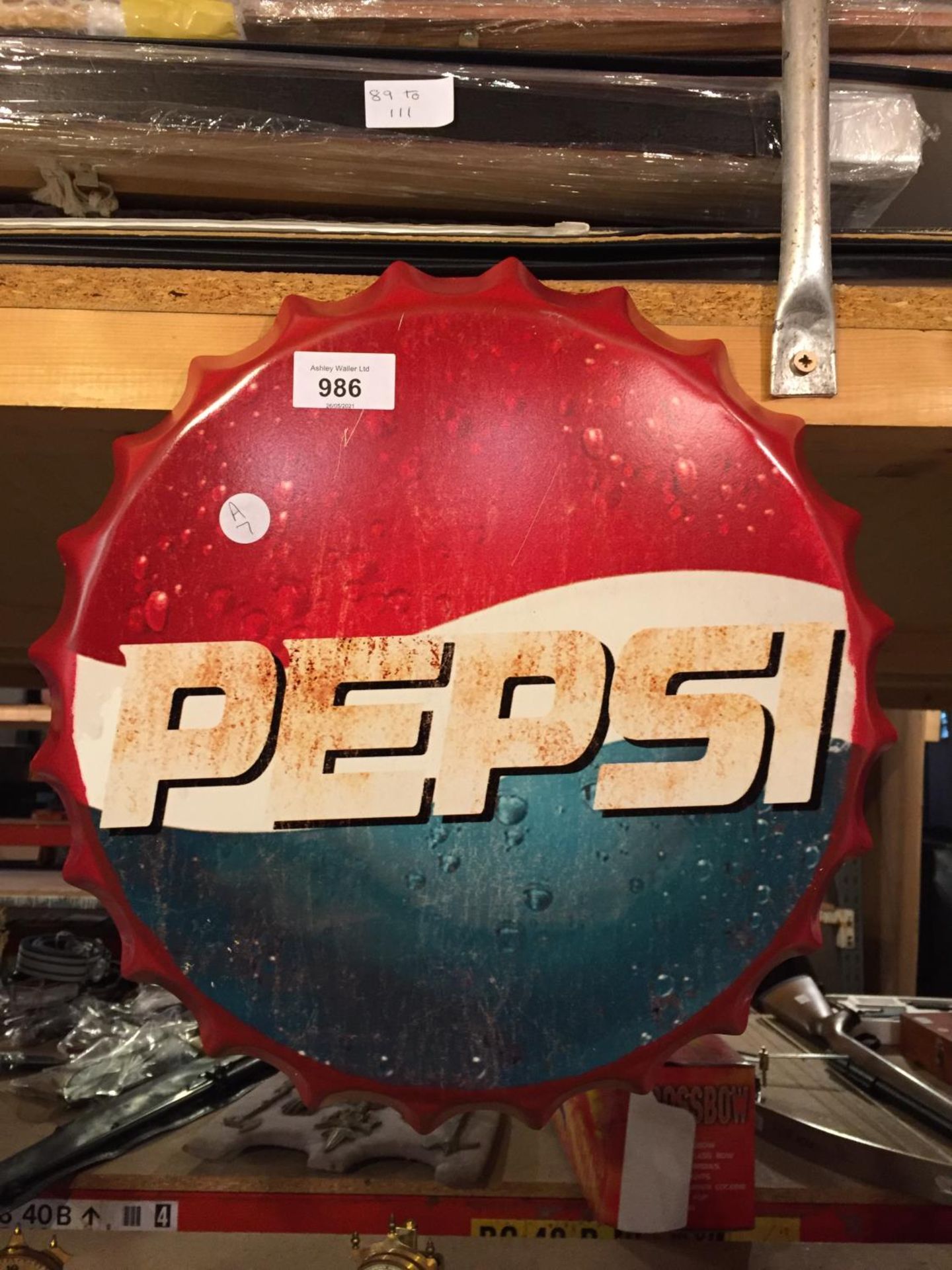 A RETRO METAL SIGN - PEPSI - BEER BOTTLE CAP DISPLAY.