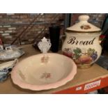 A LARGE LIDDED BREAD POT A/F HAIRLINE CRACK AND A BOWL