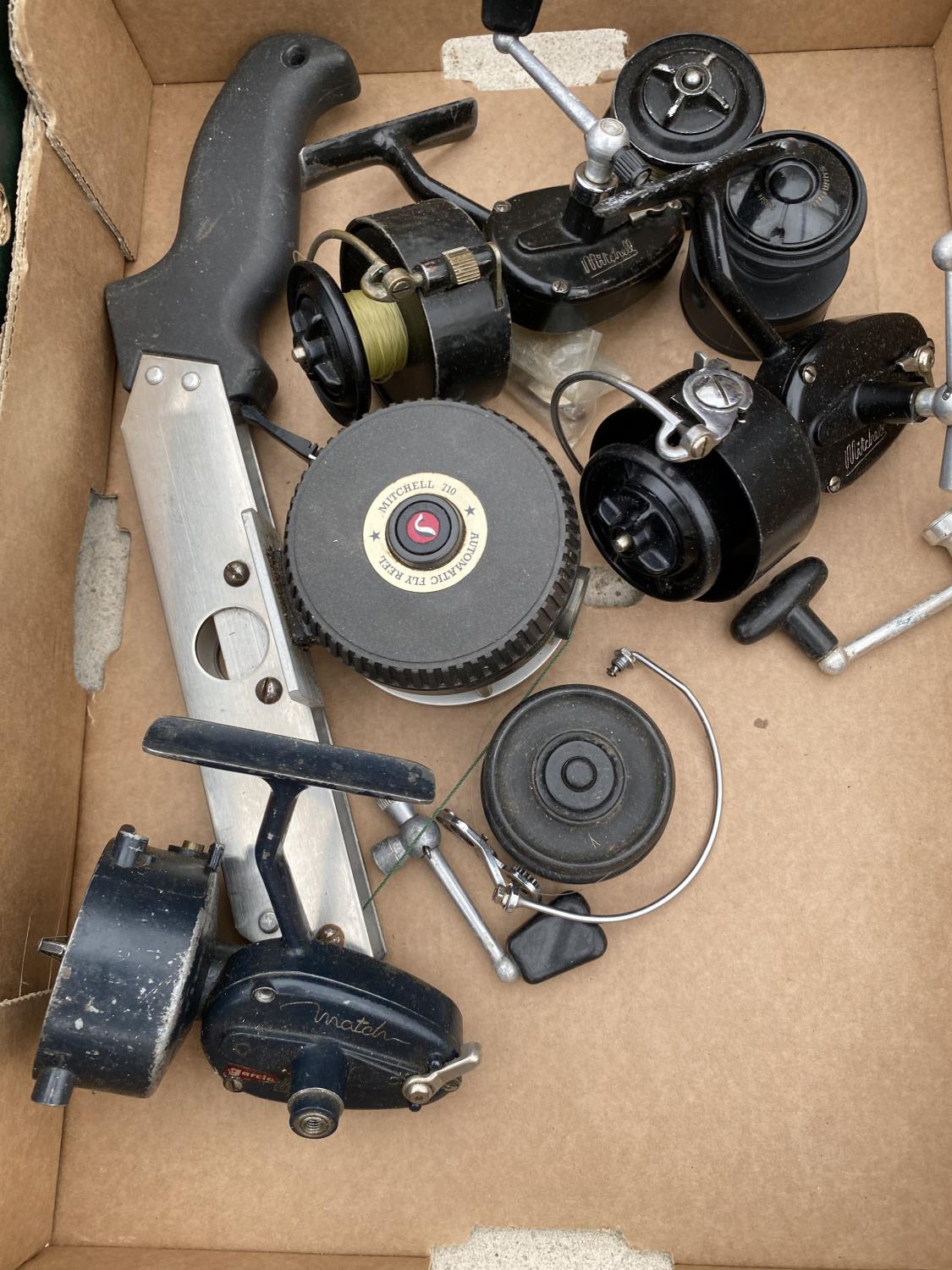 A MITCHELL 710 AUTOMATIC FLY REEL, A MITCHELL 300 REEL, 2 MITCHELL SPARE SPOOLS, A MITCHELL MATCH