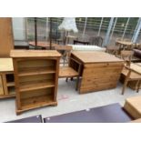A MODERN PINE THREE TIER OPEN BOOKCASE, 26.5" WIDE, DROP-LEAF TABLE AND THREE CARVER CHAIRS