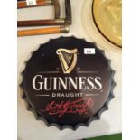 A DRAUGHT GUINESS BOTTLE CAP WALL SIGN. DIAMETER 36CM