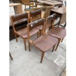 A SET OF FOUR RETRO TEAK DINING CHAIRS