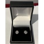 A PAIR OF 18 CARAT WHITE GOLD AND DIAMOND EARRINGS IN A PRESENTATION BOX