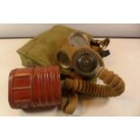 A WORLD WAR II GAS MASK AND BAG