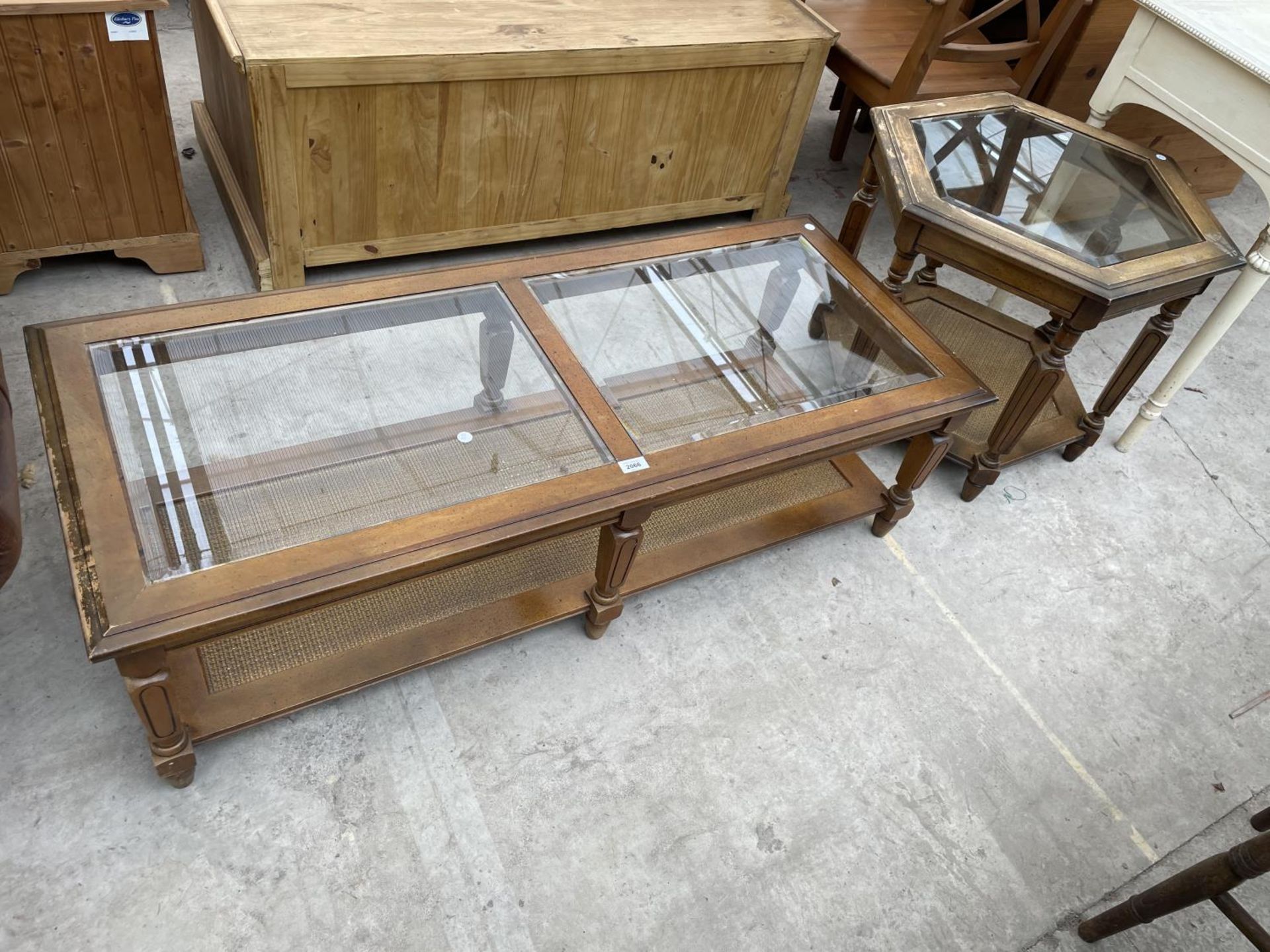 TWO GLASS TOPPED COFFEE TABLES, BOTH WITH CANE UNDERTIERS