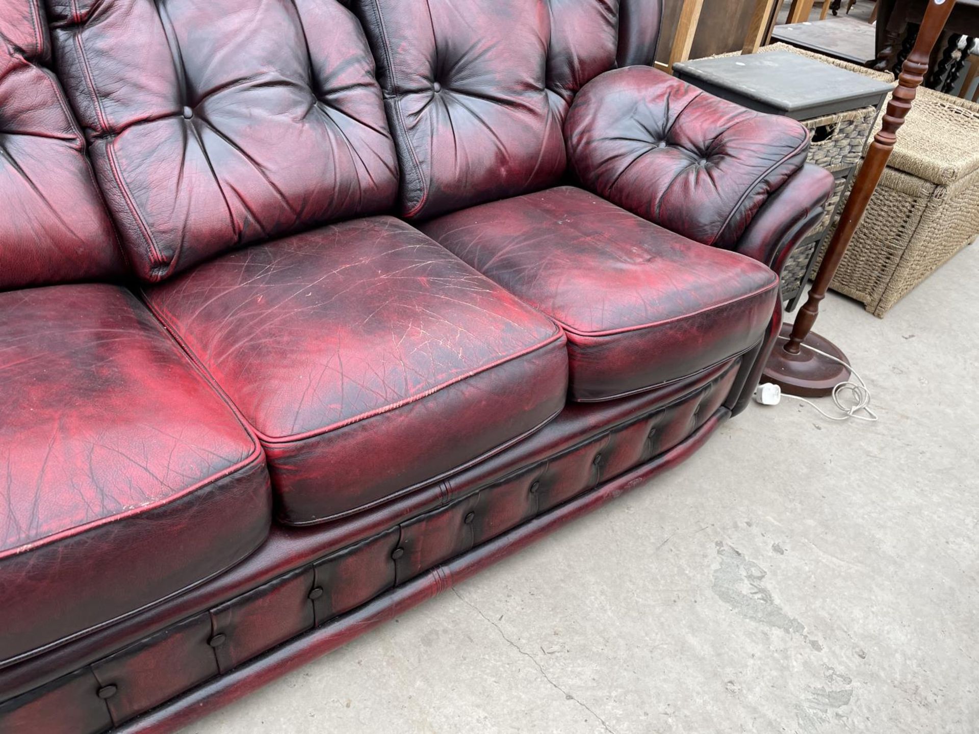 AN OXBLOOD BUTTON-BACK THREE SEATER SETTEE - Image 5 of 5