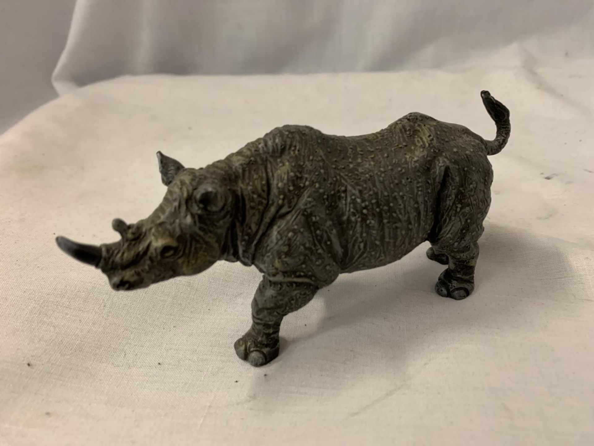 A COLD PAINTED BRONZE RHINO