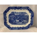 A LARGE BLUE AND WHITE MEAT PLATTER DEPICTING COCK FIGHTING AND STAMPED SPANISH FESTIVITIES 1798