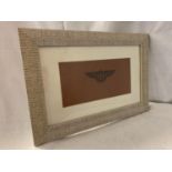 A FRAMED TAN LEATHER WITH EMBROIDERED BENTLEY LOGO