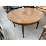 A CIRCULAR RETRO TEAK EXTENDING DINING TABLE, 44.5" DIAMETER (EXTRA LEAF 14.5")