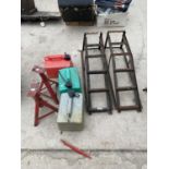 A PAIR OF CAR RAMPS, A PAIR OF AXLE STANDS AND THREE FUEL CANS