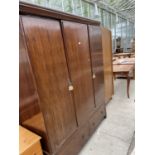 A MAHOGANY TWO DOOR WARDROBE WITH TWO DRAWERS BELOW AND AN OAK WARDROBE