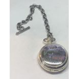 A WHITE METAL POCKET WTACH WITH AN ENAMAL PICTURE OF THE FLYING SCOTSMAN WITH A CHAIN