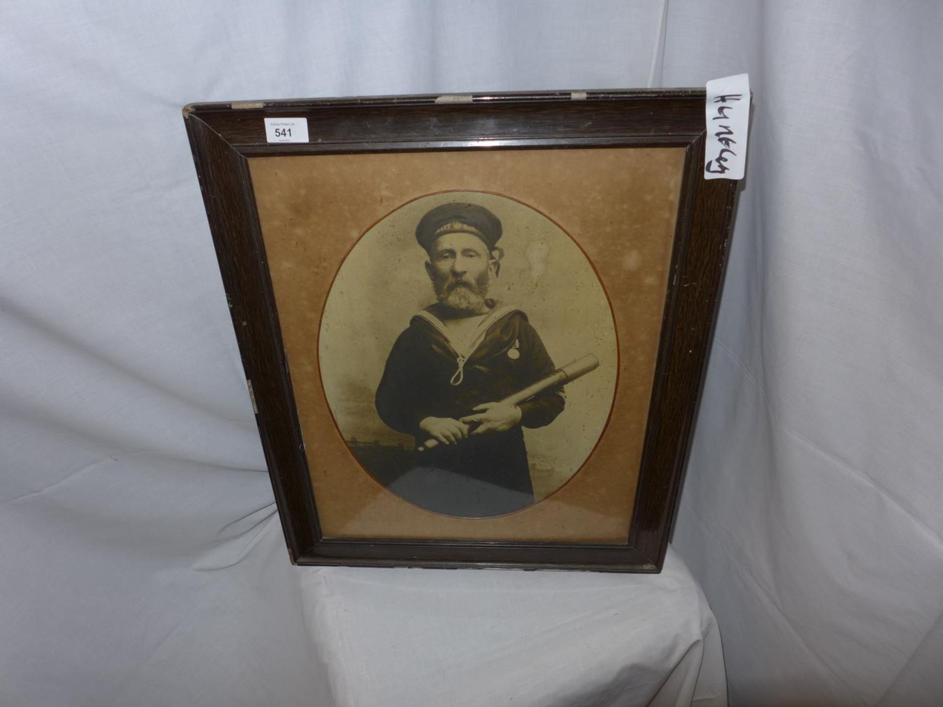 AN EARLY 20TH CENTURY FRAMED BLACK AND WHITE PHOTOGRAPH OF A SAILOR