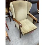 A PARKER KNOLL WINGED FIRESIDE CHAIR, MODEL NO. P.K. 732-8-9-45