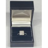 AN 18 CARAT WHITE GOLD RING WITH SIXTEEN DIAMONDS SET IN A SQUARE GROSS WIEGHT 3.9 GRAMS SIZE L/M