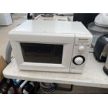 A WHITE SHARP MICROWAVE OVEN BELIEVED IN WORKING ORDER BUT NO WARRANTY