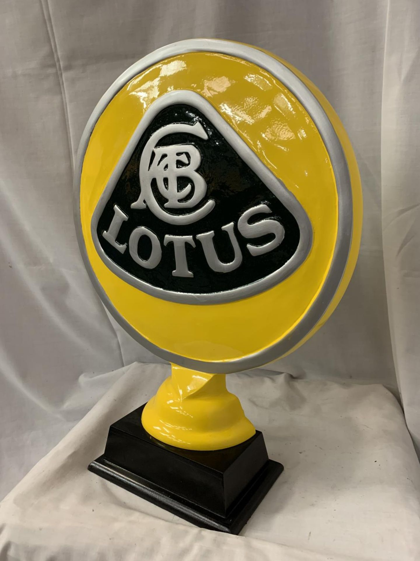 A LARGE CAST LOTUS SIGN ON A WOODEN BASE H:51CM - Image 2 of 2