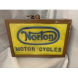 AN ILLUMINATED 'NORTON MOTOR CYCLES' SIGN