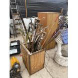 A METAL BANDED TEA CHEST WITH A LARGE ASSORTMENT OF GARDEN TOOLS TO INCLUDE SHEARS, SPADES LOPPERS