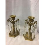 TWO HEAVY CANDLE HOLDERS WITH HANGING GLASS DROPLETS (ONE DROP NOT MATCHING AND ONE A/F)