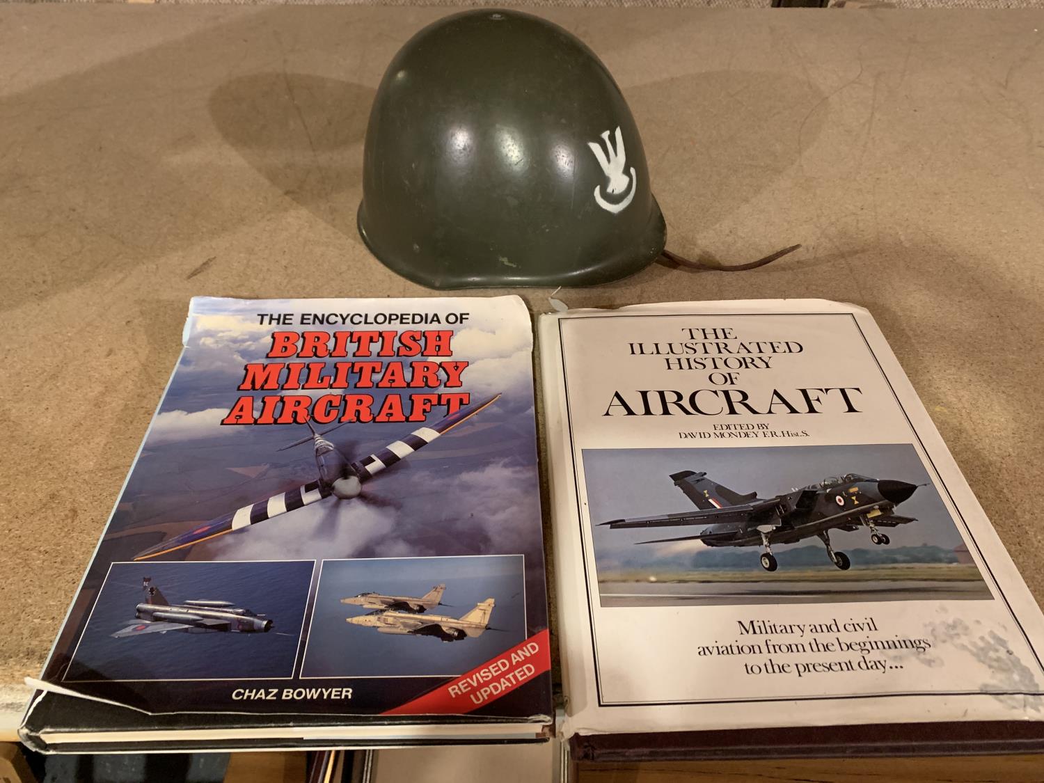 A POLISH MILITARY HELMET AND TWO AIRCRAFT BOOKS