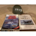 A POLISH MILITARY HELMET AND TWO AIRCRAFT BOOKS