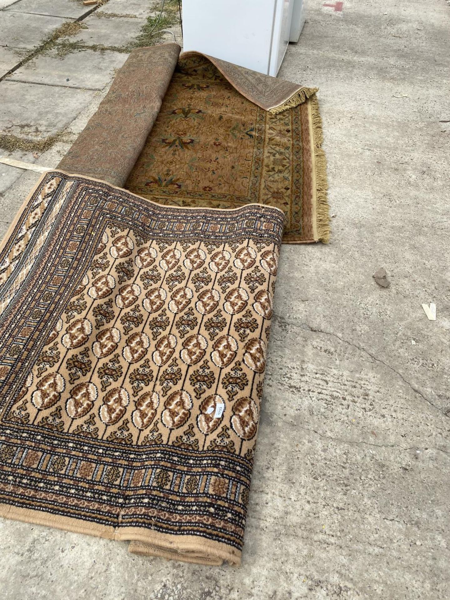 TWO BROWN PATTERNED RUGS