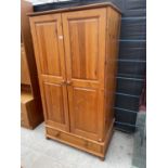 A MODERN TWO DOOR PINE WARDROBE WIWTH DRAWER TO THE BASE, 36" WIDE