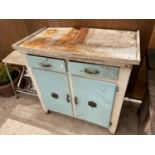 A VINTAGE KITCHEN UNIT ENCLOSING TWO DRAWERS AND TWO DOORS