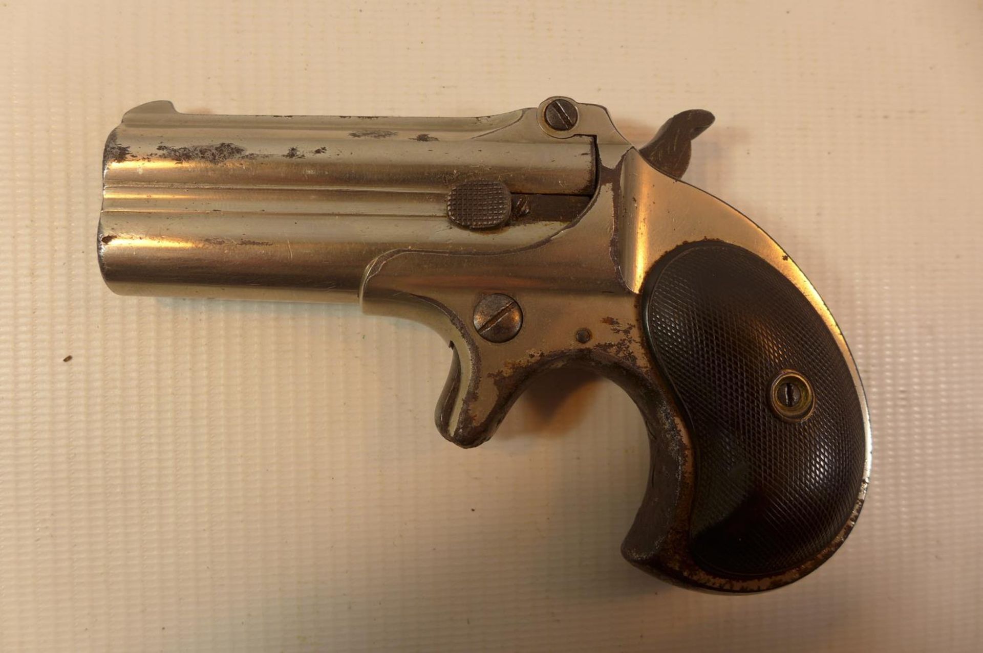 A REMINGTON 41 CALIBRE RIMFIRE OVER AND UNDER DERRINGER, WITH A 7.5CM BARREL MARKED REMINGTON ARMS