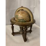 A VINTAGE STYLE GLOBE ON A WOODEN STAND