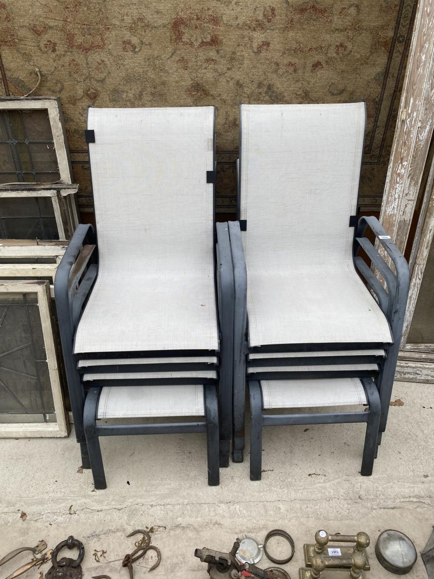 A GROUP OF SIX METAL FRAMED GARDEN CHAIRS TO INCLUDE TWO FOOT STOOLS
