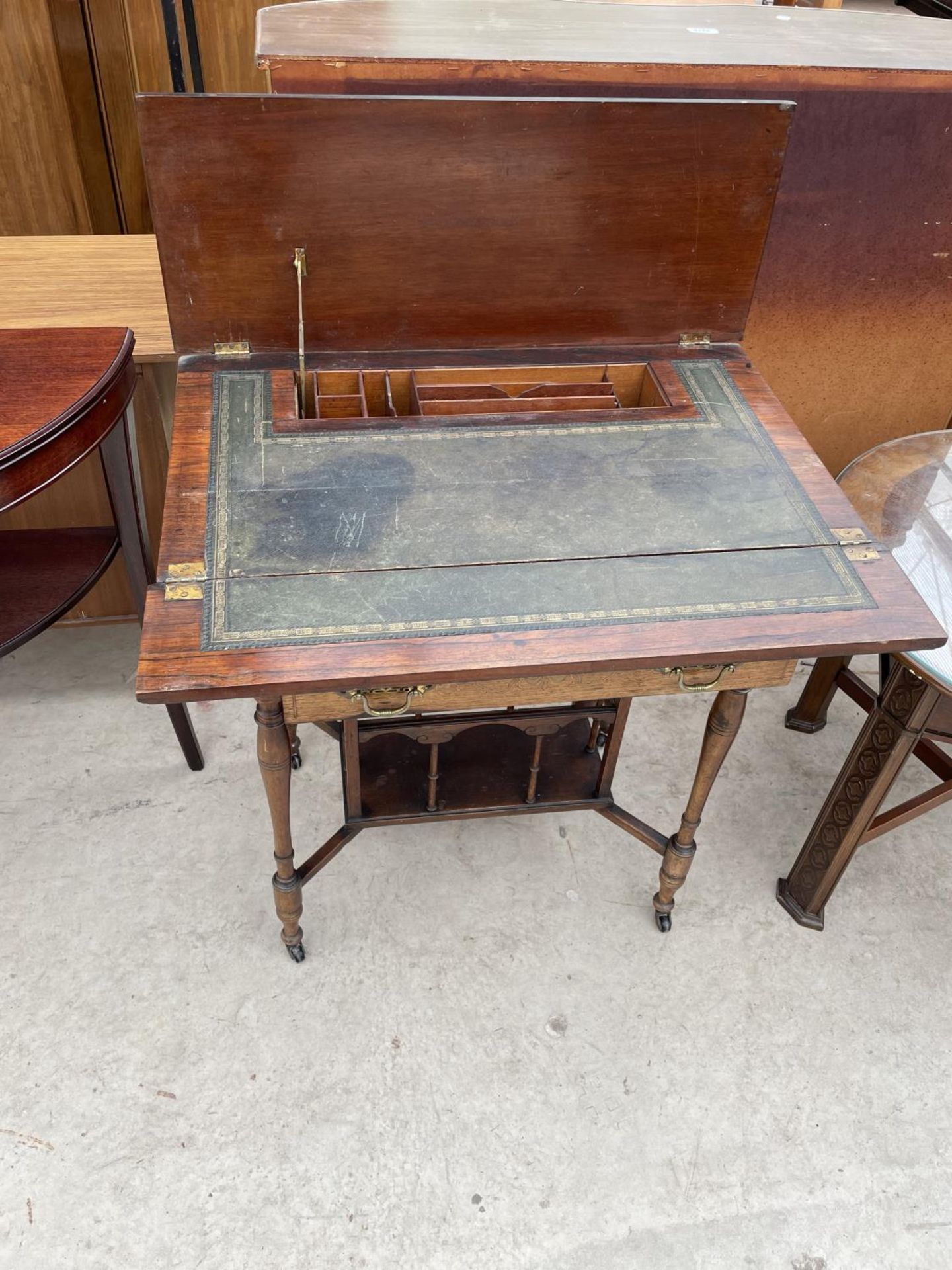 AN EDWARDIAN MAHOGANY AND INLAID FOLD OVER WRITING TABLE STAMPED J.A.S. SHOOLBRED & CO, 27" WIDE