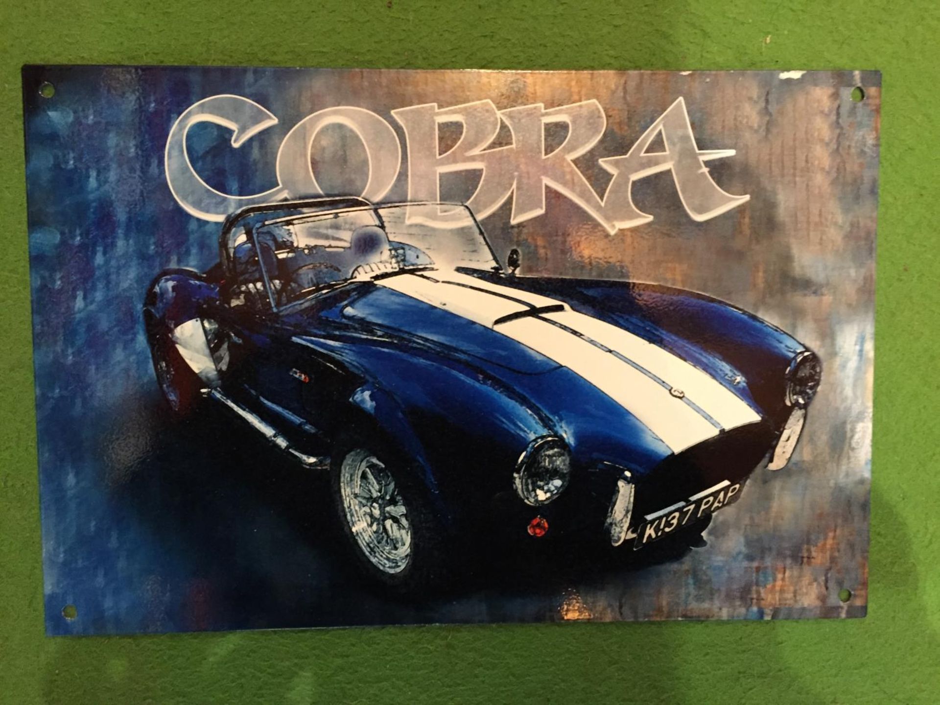 A 'COBRA' METAL SIGN