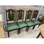 A SET OF FOUR ART NOUVEAU STYLE DINING CHAIRS WITH SHAPED AND STUDDED BACK